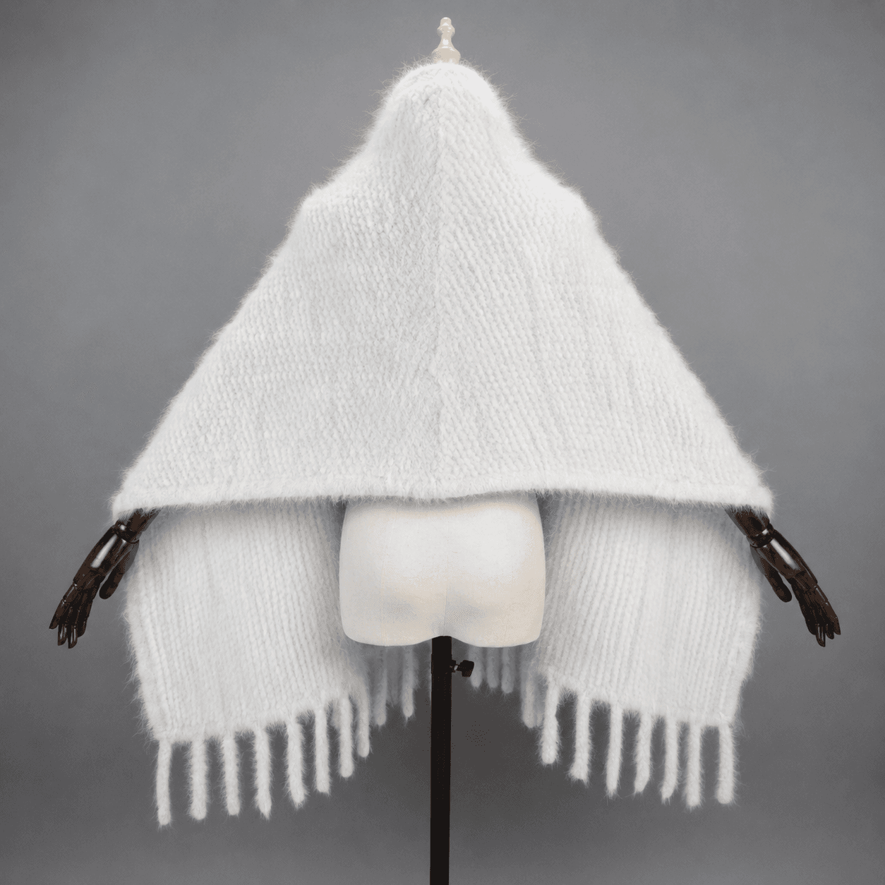Ivory knitted mink scarf draped as a hood